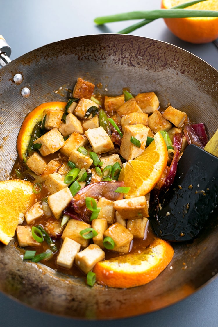 Asian Pan-Fried Orange Tofu recipe made with tofu, orange juice & zest, onions, sesame seeds, and more. A simple, healthy & delicious vegan lunch / dinner. #vegan #orange #tofu #asian #lunch #dinner #recipe #pan-fried #healthy 
