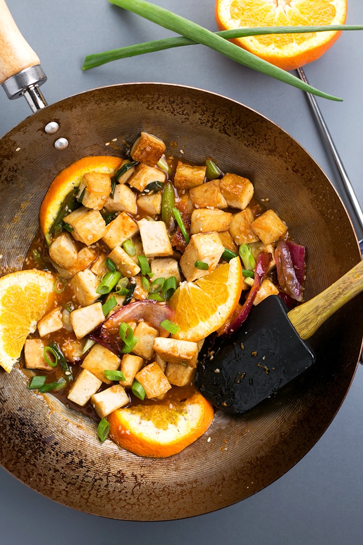 Asian Pan-Fried Orange Tofu recipe made with tofu, orange juice & zest, onions, sesame seeds, and more. A simple, healthy & delicious vegan lunch / dinner. #vegan #orange #tofu #asian #lunch #dinner #recipe #pan-fried #healthy 