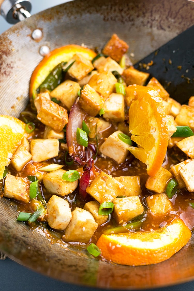 Asian Pan-Fried Orange Tofu recipe made with tofu, orange juice & zest, onions, sesame seeds, and more. A simple, healthy & delicious vegan lunch / dinner. #vegan #orange #tofu #asian #lunch #dinner #recipe #pan-fried #healthy 