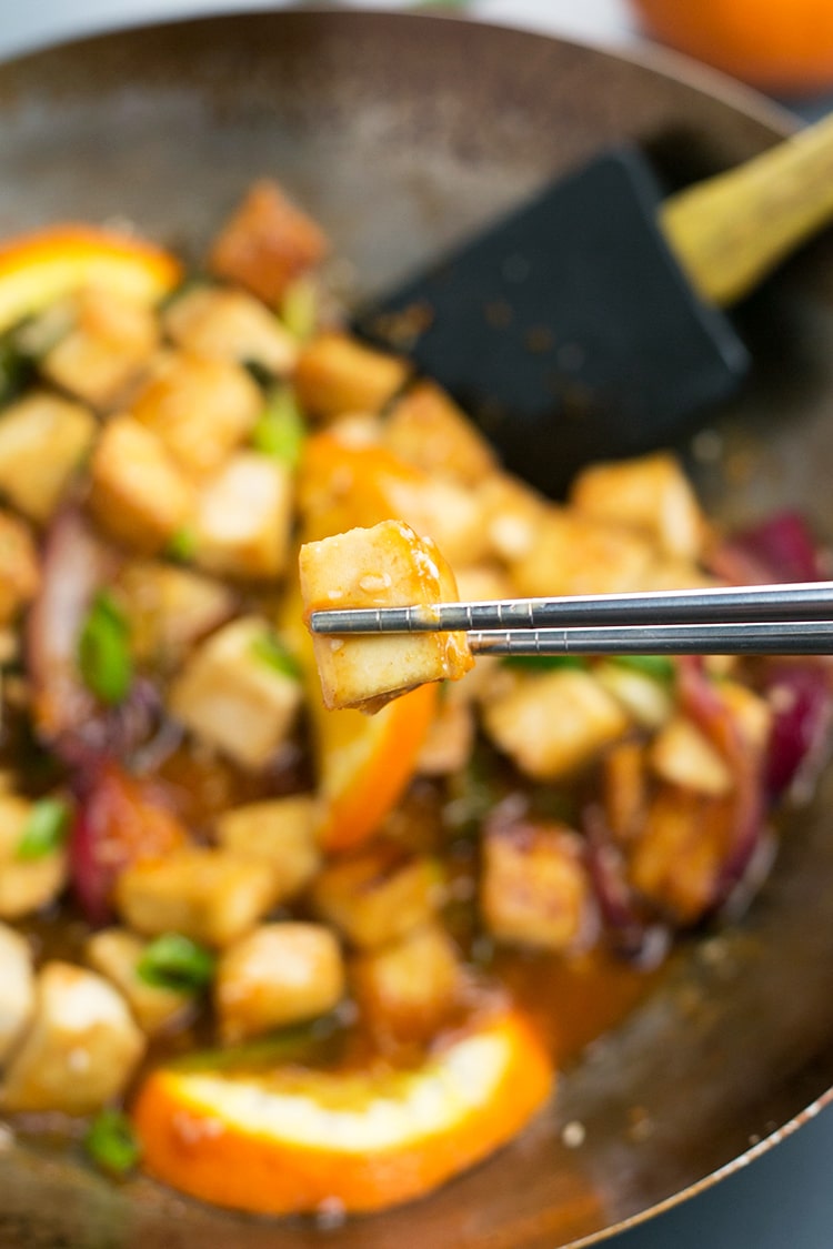 Asian Pan-Fried Orange Tofu recipe made with tofu, orange juice & zest, onions, sesame seeds, and more. A simple, healthy & delicious vegan lunch / dinner. #vegan #orange #tofu #asian #lunch #dinner #recipe #pan-fried #healthy 