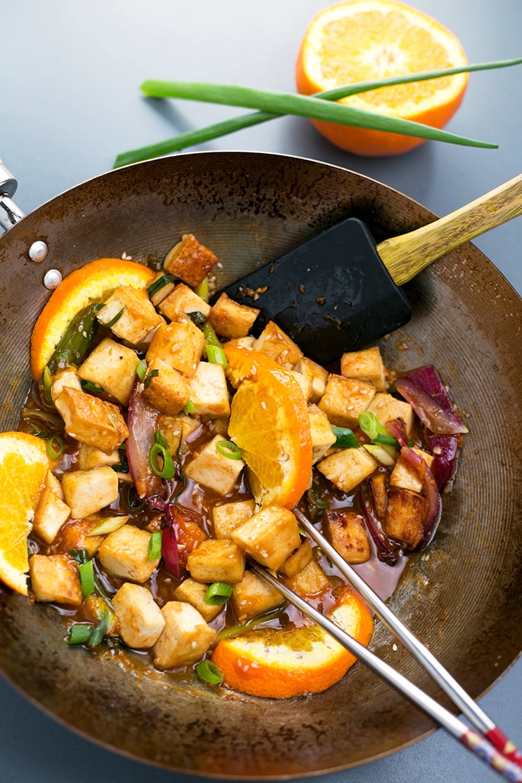 Asian Pan-Fried Orange Tofu recipe made with tofu, orange juice & zest, onions, sesame seeds, and more. A simple, healthy & delicious vegan lunch / dinner. #vegan #orange #tofu #asian #lunch #dinner #recipe #pan-fried #healthy 