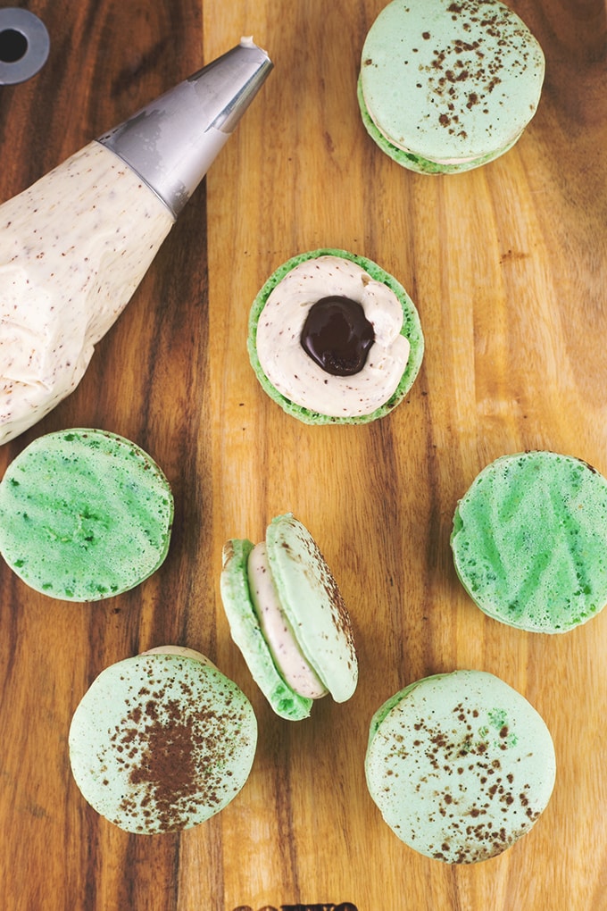 Mint Chocolate Chip Vegan Macarons using Aquafaba (Chickpea Brine). Sweet, Minty, full of Chocolate and 100% delicious. #vegan #macarons #aquafaba #chickpea #chocolate #veganrecipe #dessert #veganmacarons #sweets #dessert