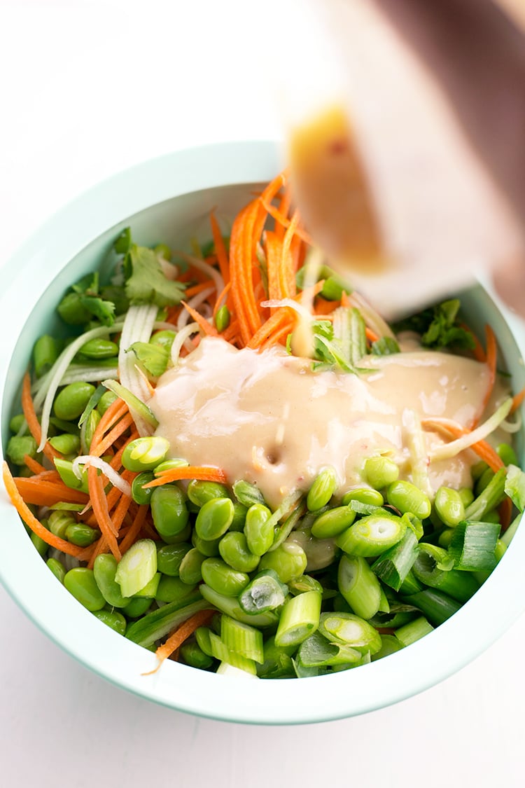 Japanese inspired Soba Noodles with edamame, carrot and cucumber - tossed in a delicious Miso Tahini Dressing. Vegan and Gluten Free. #vegan #japanese #asian #soba #healthy #foodporn #tahini #ginger #noodles